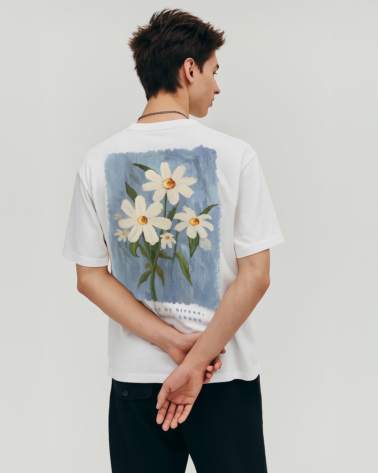 GRPHX Bloom Through Chaos back view – white oversized cotton tee